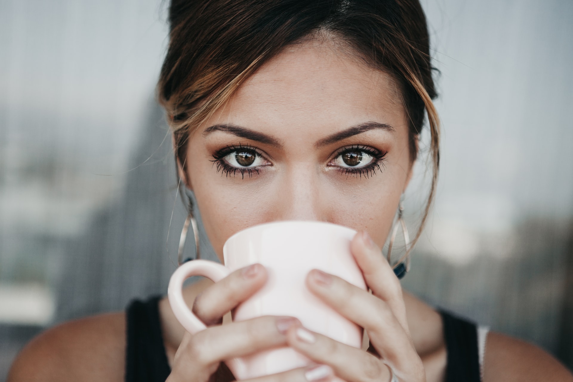 woman drinking cold brew coffee